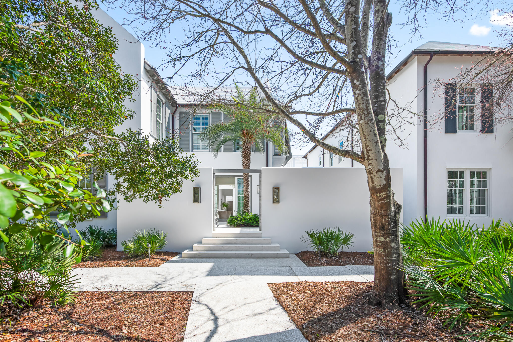 a front view of a house with garden