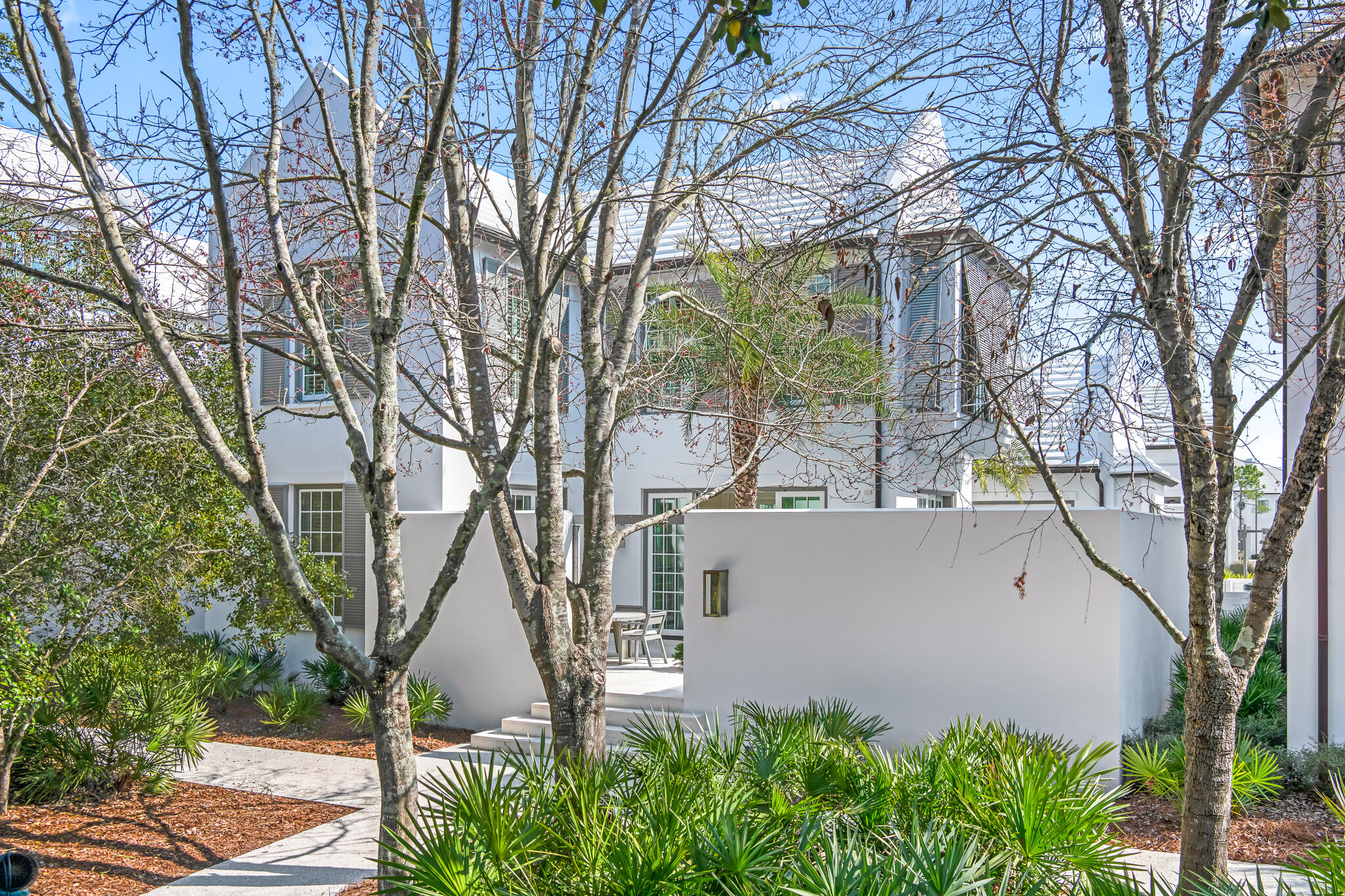 75 Featherbed Alley Inlet Beach, FL 32461 - Photo 2 of 49 a white house that has a tree in it