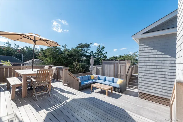 a view of a balcony with wooden floor