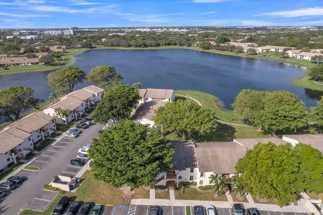 an aerial view of a house with a lake view