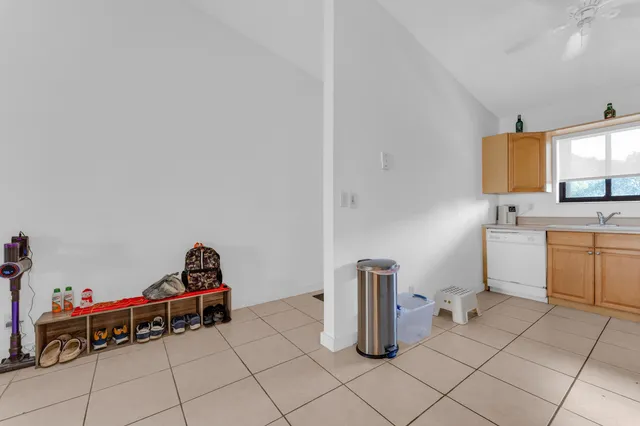a utility room with sink dryer and washer