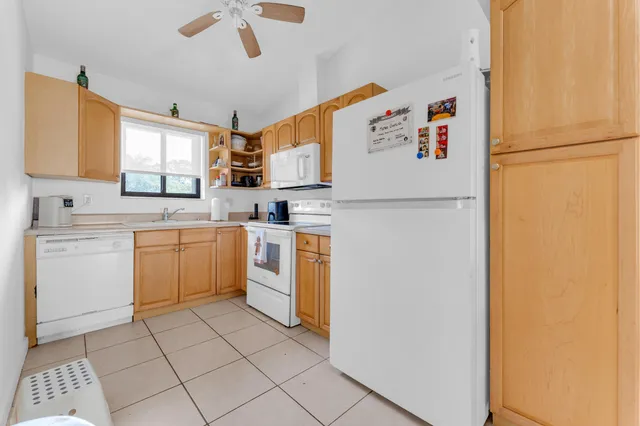 a utility room with sink washer and dryer