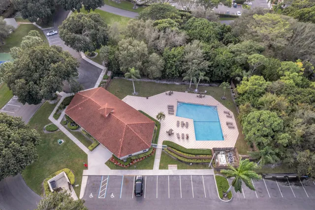 an aerial view of house with pool outdoor seating and yard