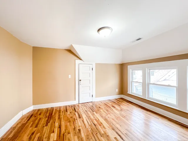a view of an empty room and window