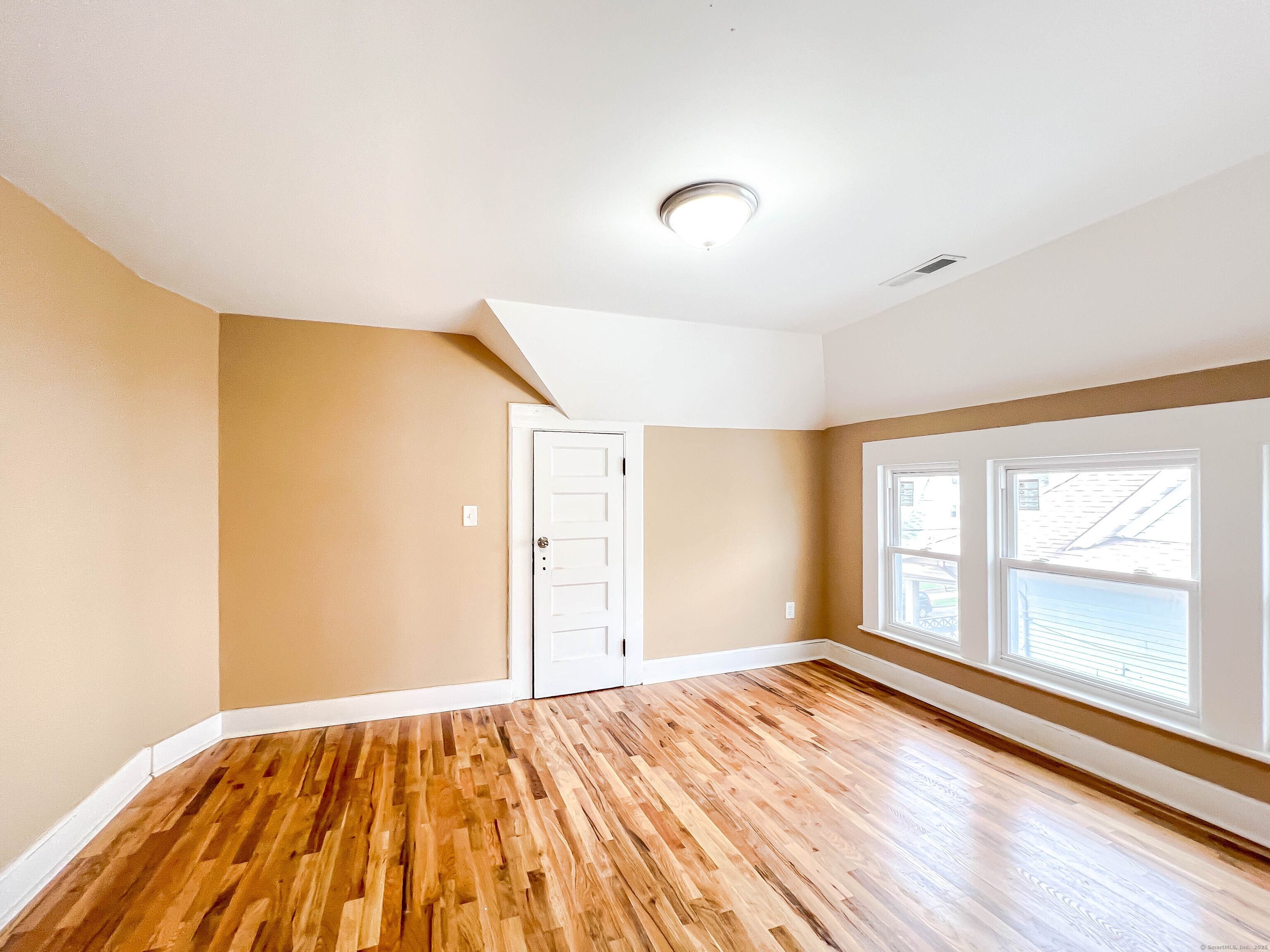 63 Eaton Street, Unit 3 Bridgeport, CT 06604 - Photo 4 of 11 a view of an empty room and window