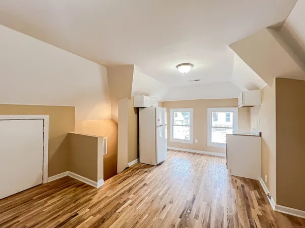 a view of a livingroom with wooden floor