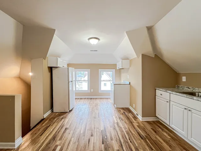 a view of a kitchen from the hallway