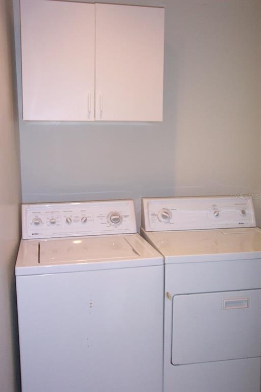 2786 Curry Ford Road, Unit 6B Orlando, FL 32806 - Photo 5 of 27 a utility room with dryer and washer