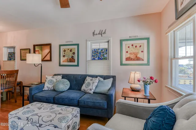a dining room with furniture wooden floor and a chandelier