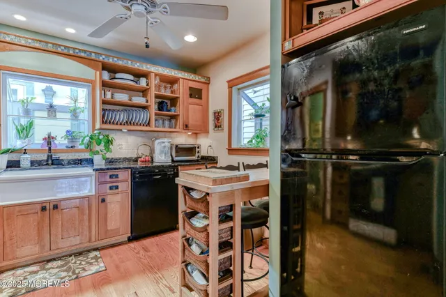 a bed sitting in a bedroom next to a book shelf