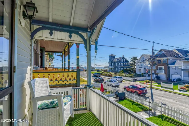 a front view of a residential apartment building with a yard