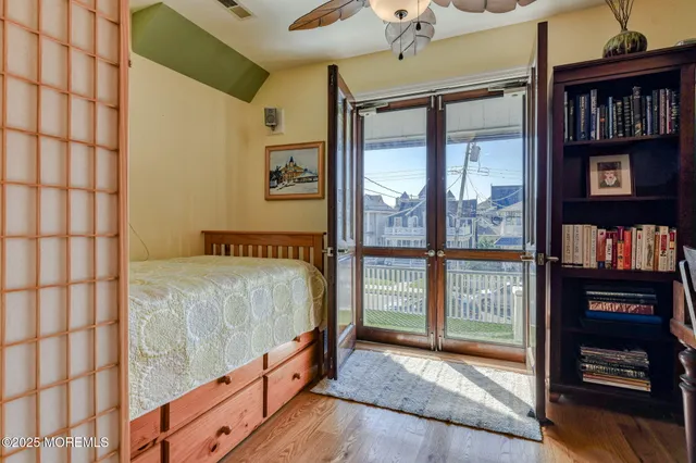 a bedroom with a bed and a view of bedroom