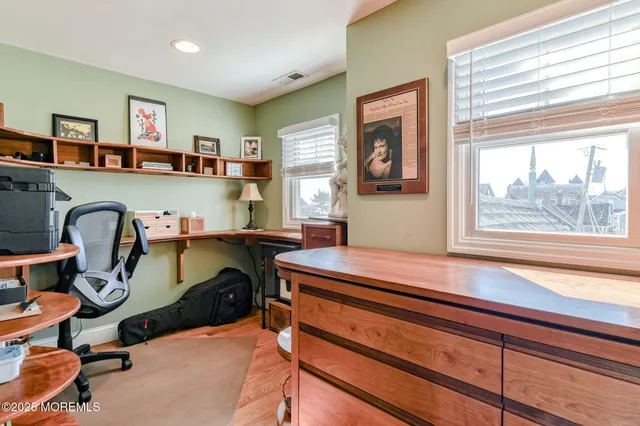 a front view of a residential apartment building with a yard