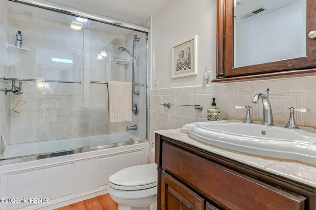 a picture of a bench in front of a wall