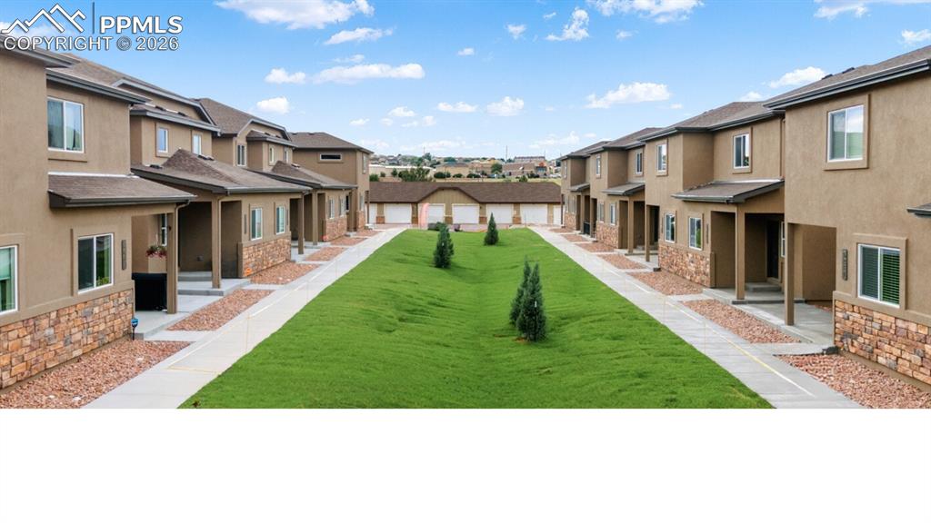 5201 Palomino Ranch Point Colorado Springs, CO 80922 - Photo 21 of 24 a view of a yard in front of house