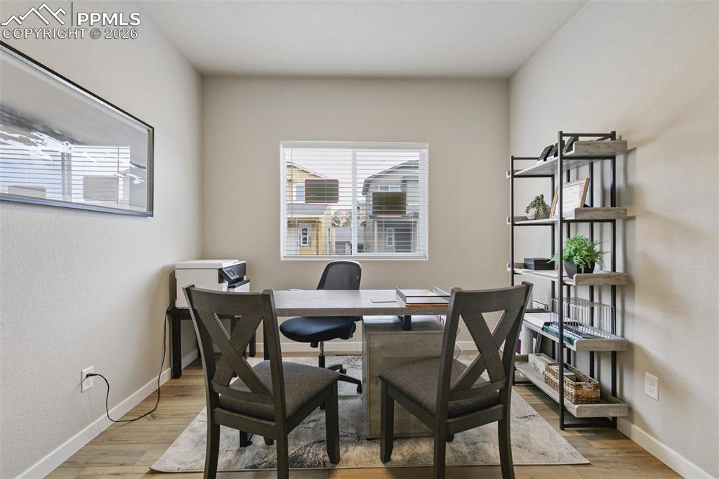 5201 Palomino Ranch Point Colorado Springs, CO 80922 - Photo 7 of 24 a view of a dining room with furniture and window