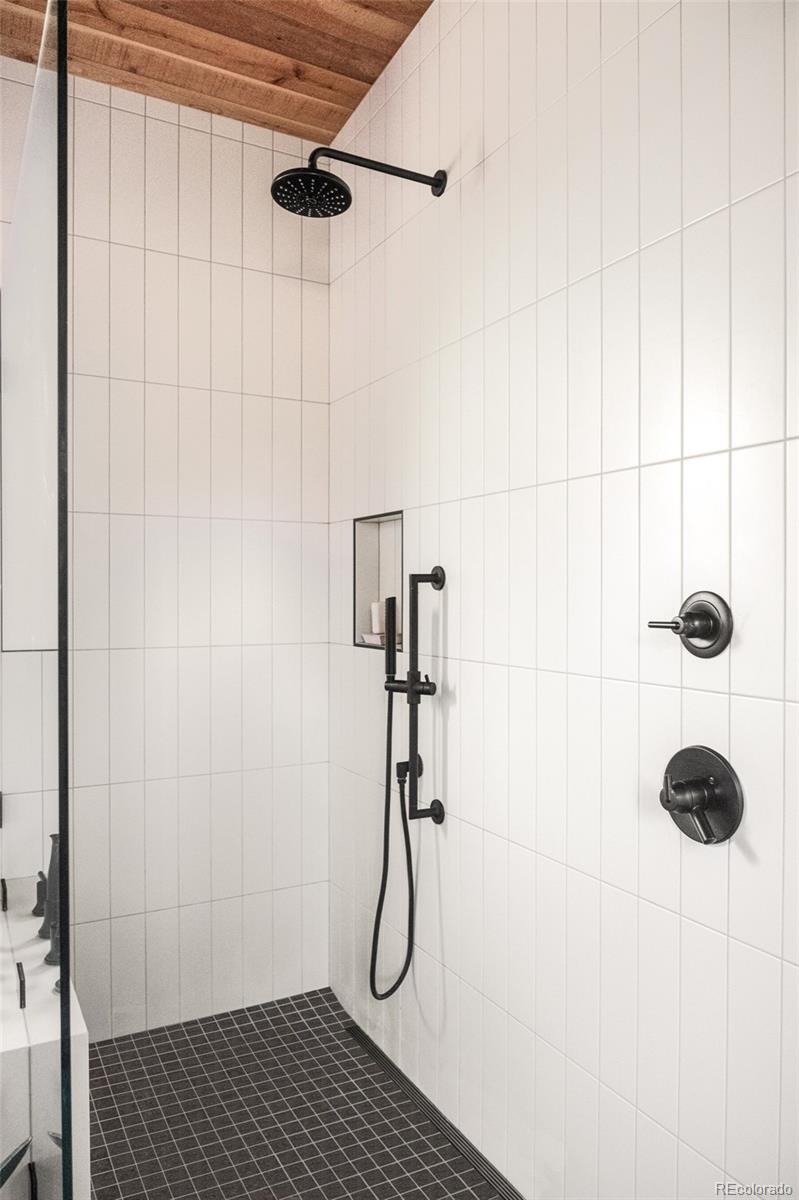 2977 Forest Street Denver, CO 80207 - Photo 12 of 23 a bathroom with a shower