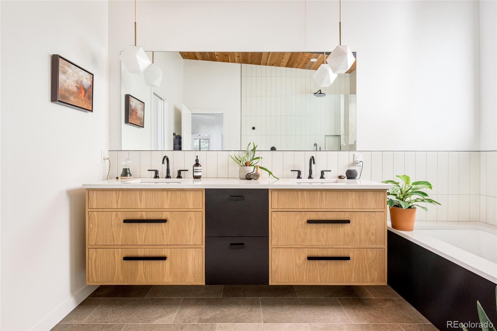 2977 Forest Street Denver, CO 80207 - Photo 14 of 23 a bathroom with a sink and a mirror