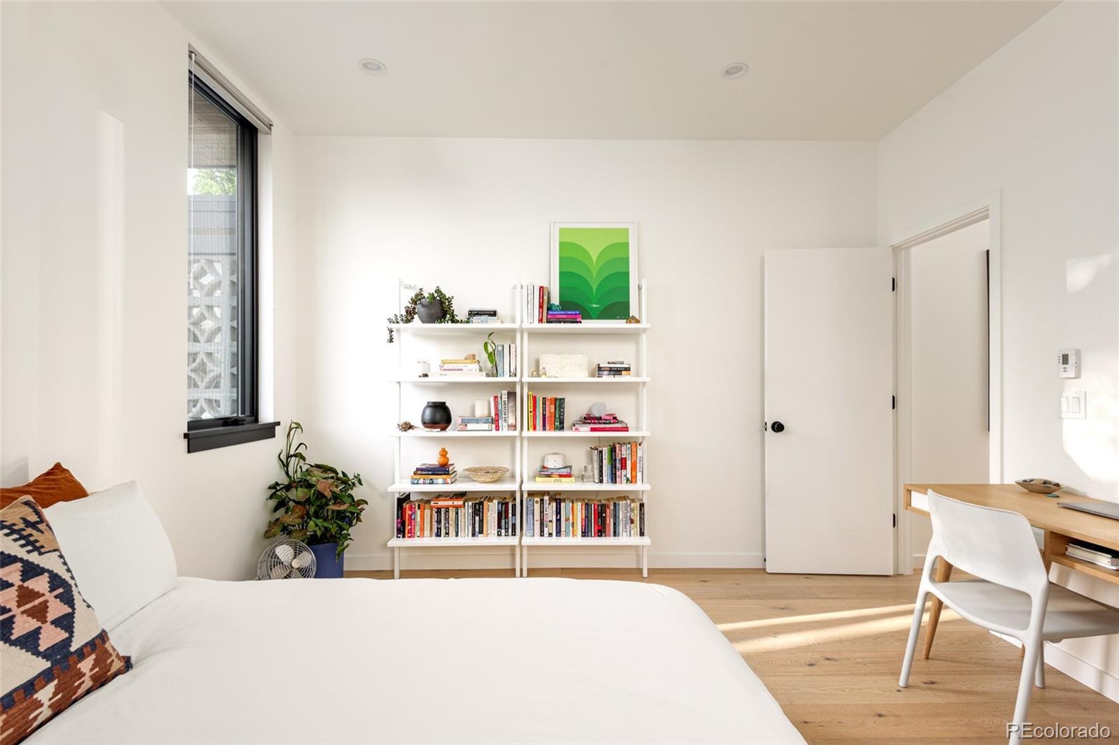 2977 Forest Street Denver, CO 80207 - Photo 16 of 23 a living room with furniture and a window