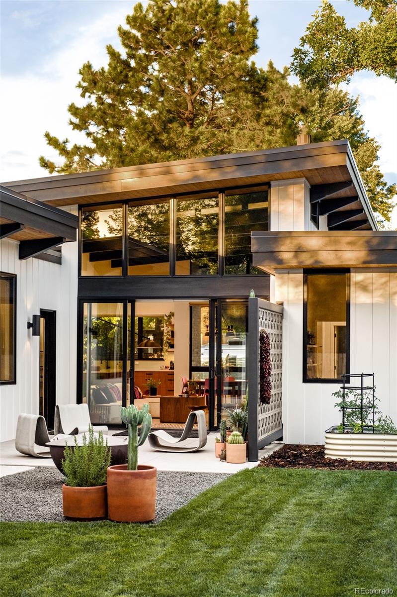 2977 Forest Street Denver, CO 80207 - Photo 19 of 23 a view of a house with backyard porch and sitting area