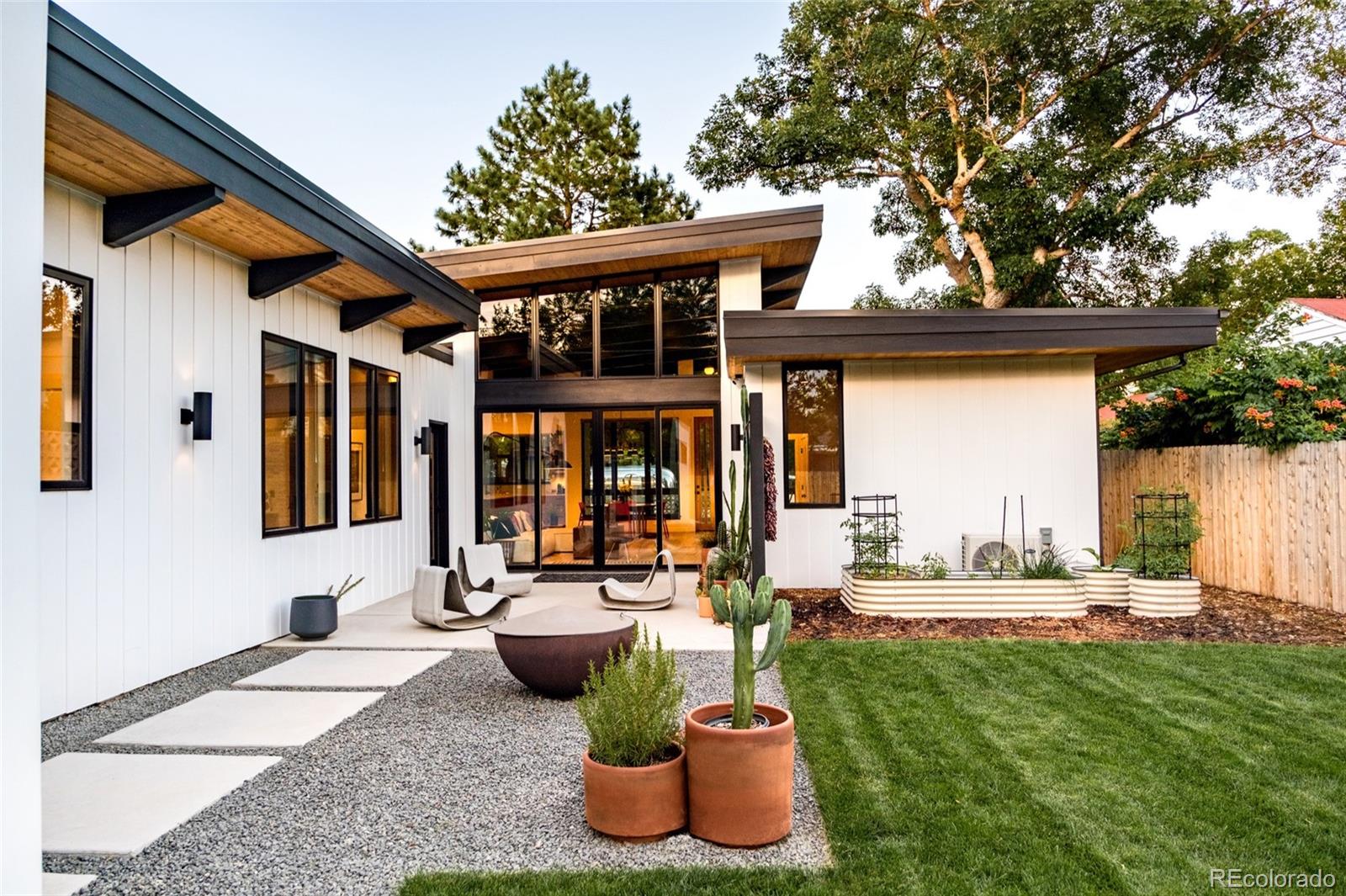 2977 Forest Street Denver, CO 80207 - Photo 20 of 23 a front view of a house with outdoor seating