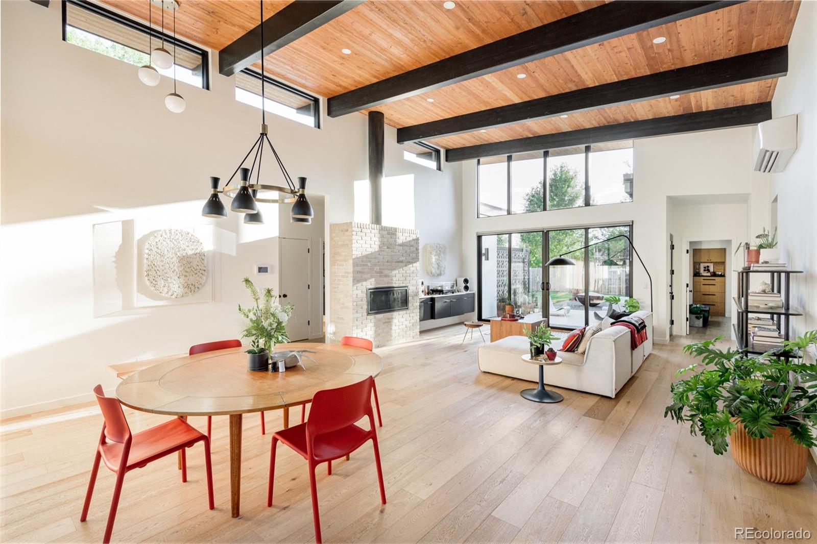 2977 Forest Street Denver, CO 80207 - Photo 7 of 23 a living room with furniture and wooden floor