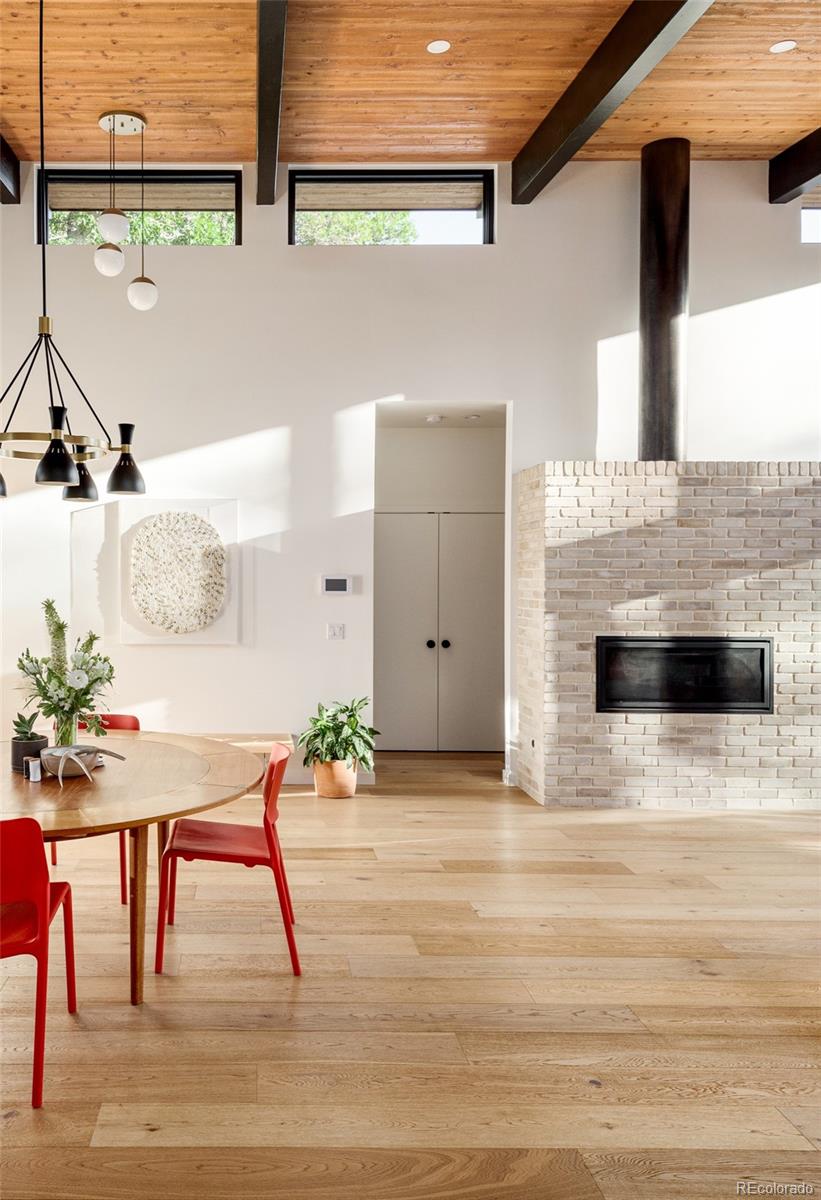 2977 Forest Street Denver, CO 80207 - Photo 9 of 23 a view of dining room with furniture and window