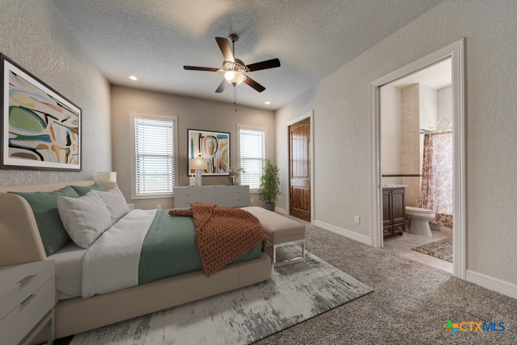 2420 Bolton Road Marion, TX 78124 - Photo 16 of 30 a bedroom with a large bed and a chandelier