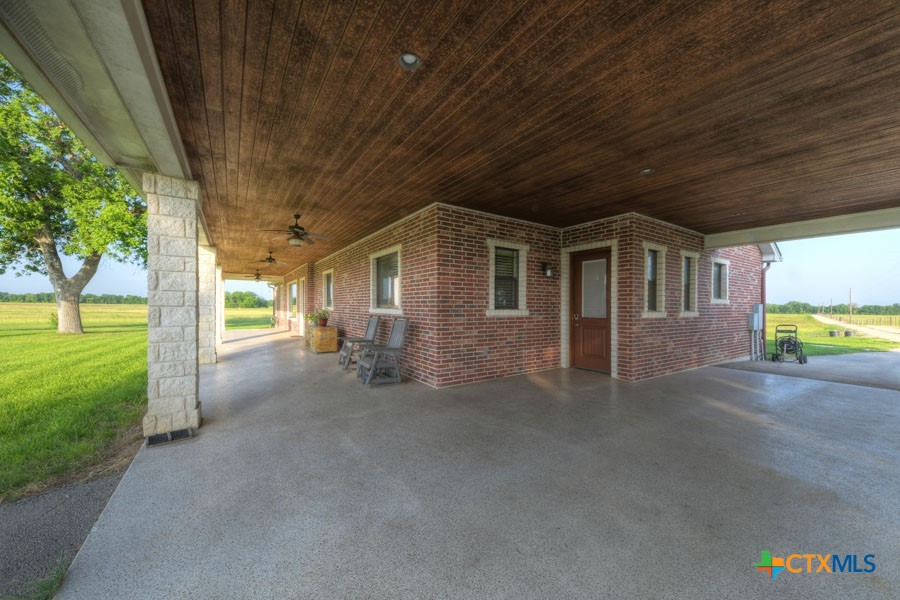 2420 Bolton Road Marion, TX 78124 - Photo 26 of 30 a view of a house with backyard and a tree