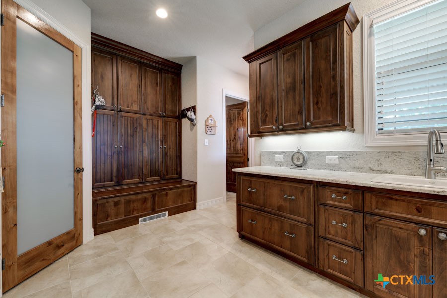 2420 Bolton Road Marion, TX 78124 - Photo 6 of 30 a kitchen with stainless steel appliances granite countertop a refrigerator and a sink