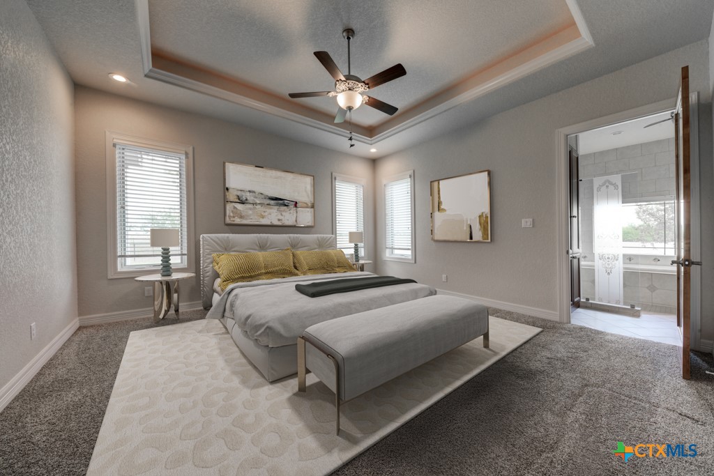 2420 Bolton Road Marion, TX 78124 - Photo 9 of 30 a bedroom with a large bed and a chandelier