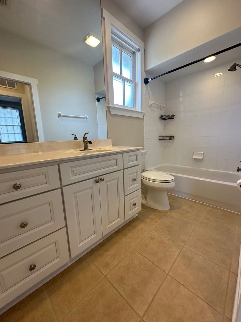 1896 Floyd Street Fernandina Beach, FL 32034 - Photo 4 of 16 a bathroom with a sink a toilet and shower