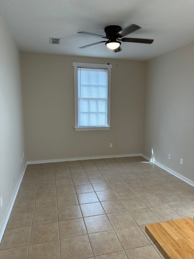 1896 Floyd Street Fernandina Beach, FL 32034 - Photo 8 of 16 a view of an empty room with a window