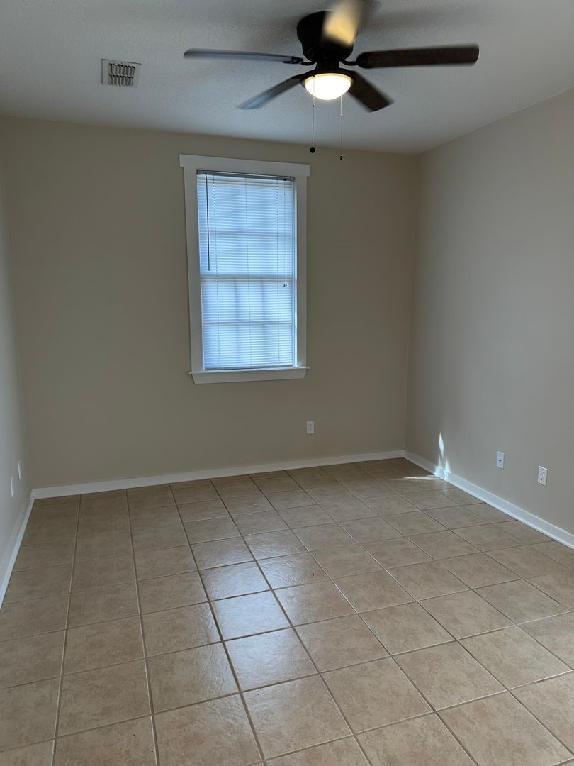 1896 Floyd Street Fernandina Beach, FL 32034 - Photo 9 of 16 an empty room with a empty space and windows