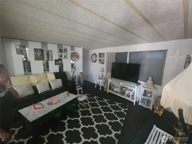 a bed room with a bed and a television