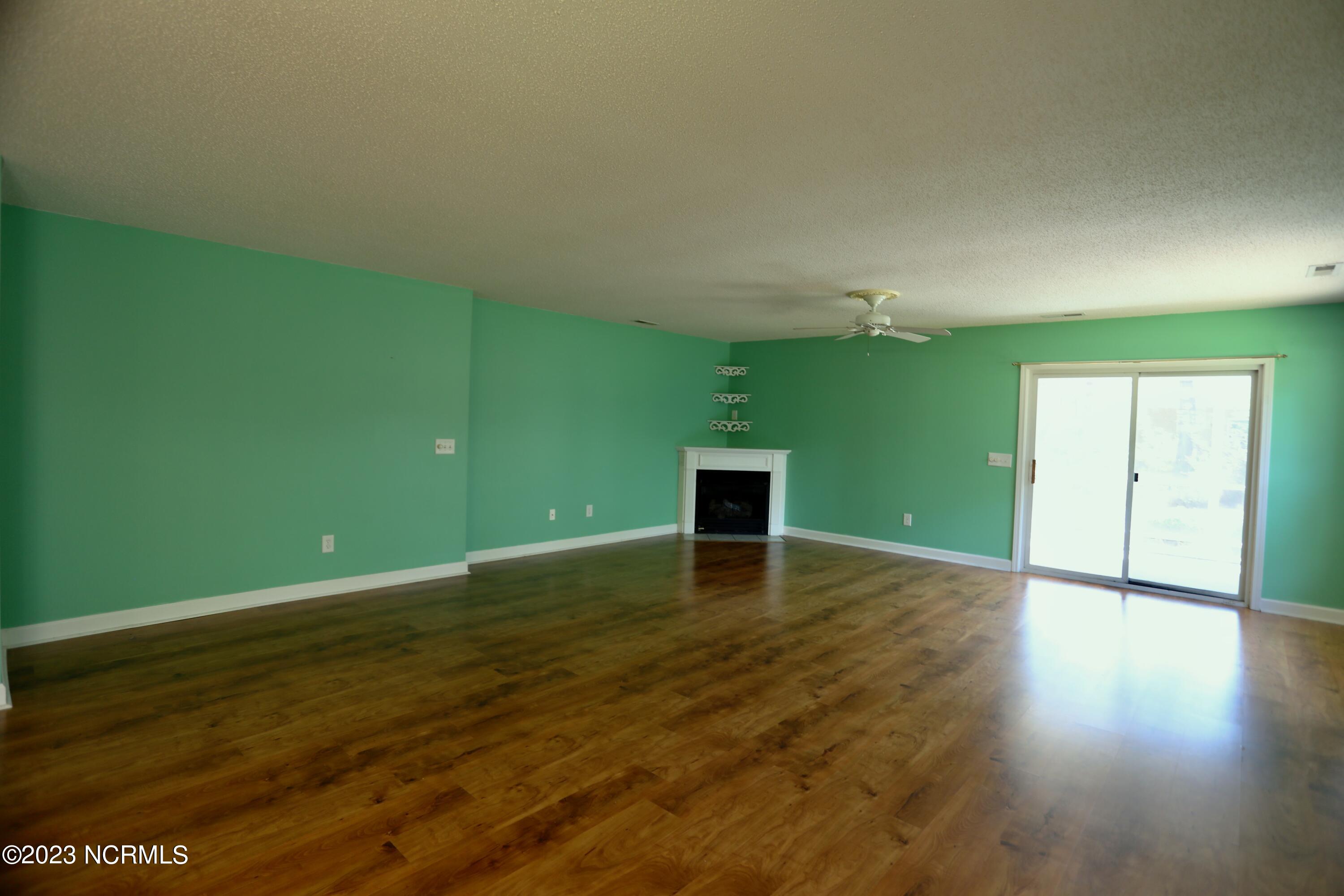 545 Pinehurst Trace Drive Pinehurst, NC 28374 - Photo 20 of 32 Living Room offers Corner Propane Fireplace