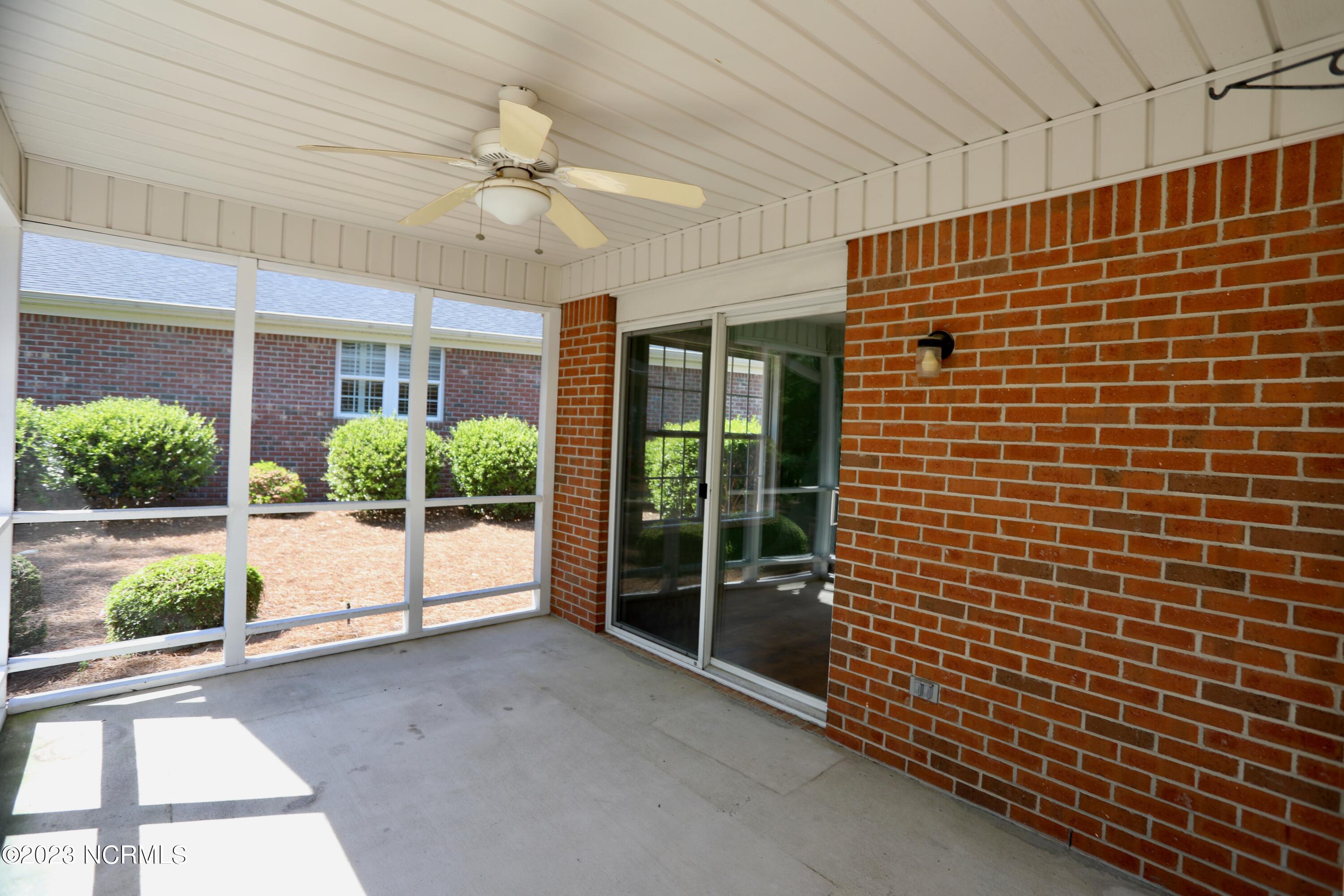 545 Pinehurst Trace Drive Pinehurst, NC 28374 - Photo 25 of 32 Concrete floors on Screen Porch