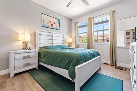 a spacious bedroom with a bed and a window