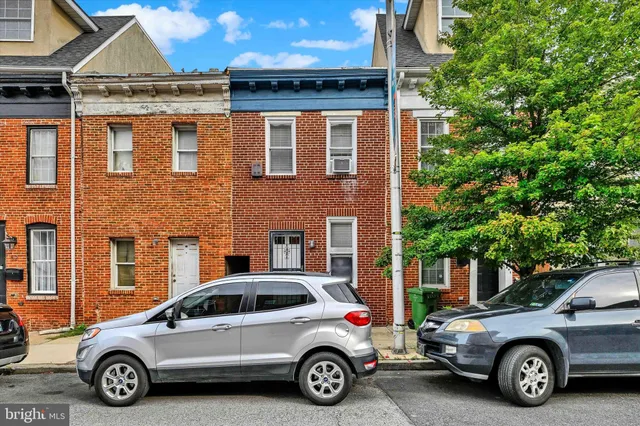 a car parked in front of a house