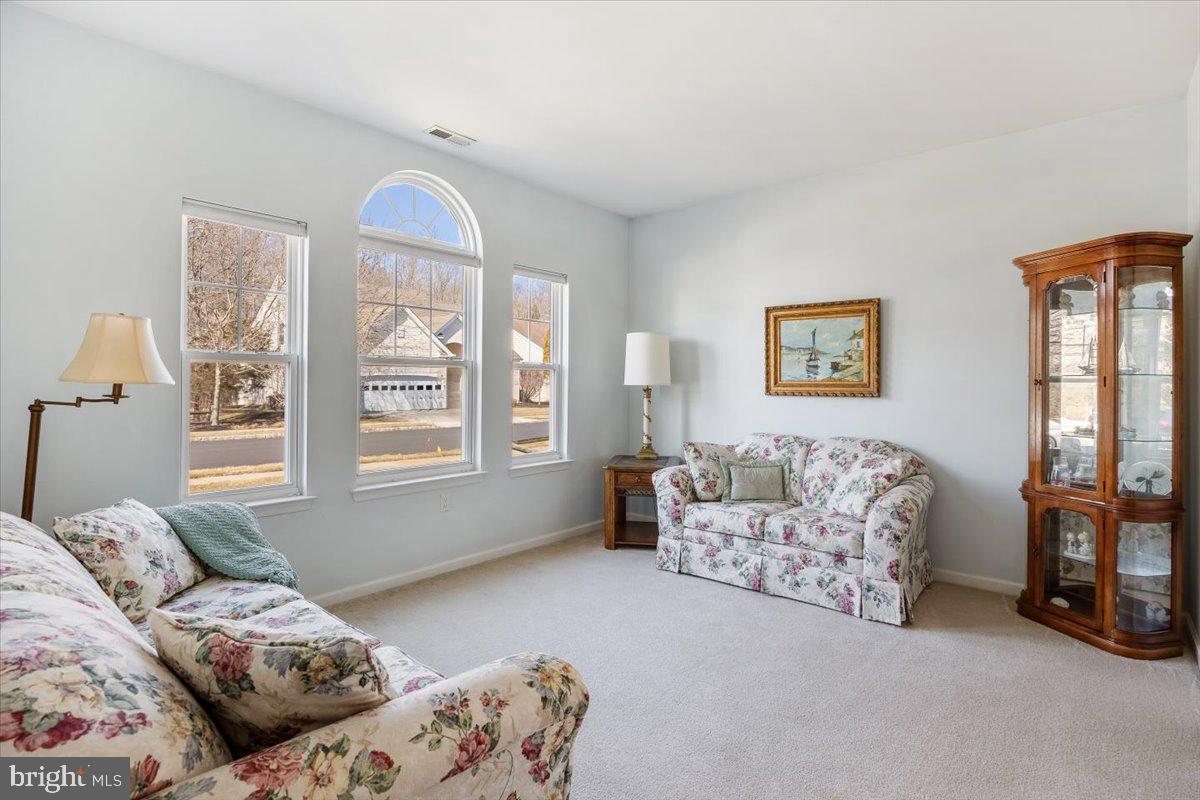 131 Lowell Drive Marlton, NJ 08053 - Photo 14 of 60 a living room with furniture and a large window