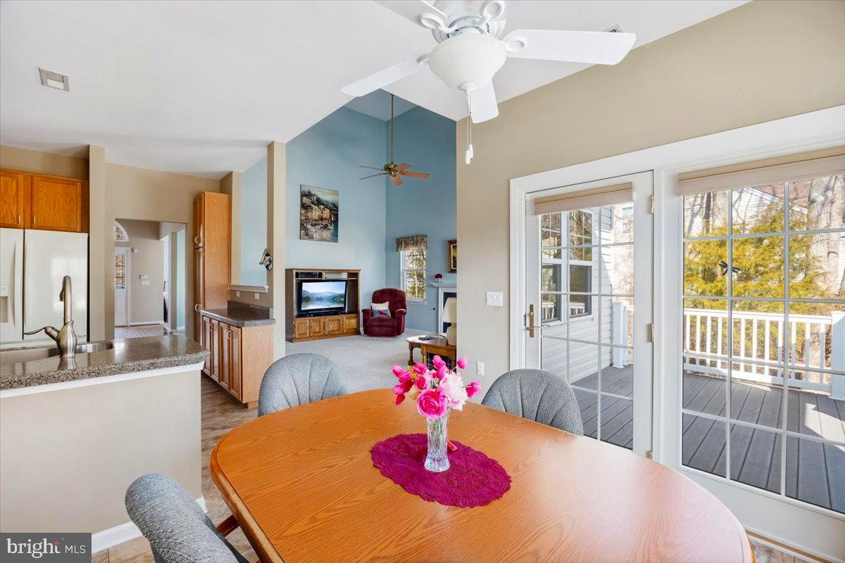 131 Lowell Drive Marlton, NJ 08053 - Photo 25 of 60 a view of a dining room with furniture a chandelier and large windows