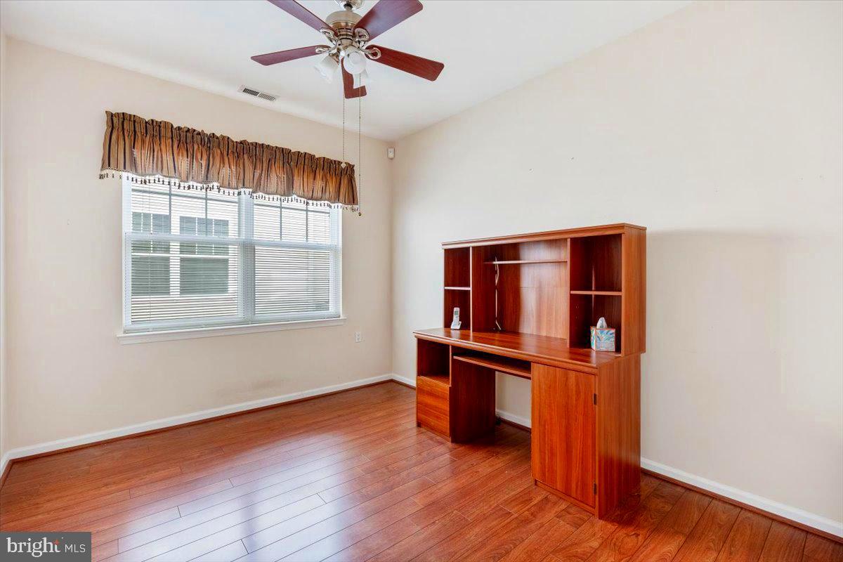 131 Lowell Drive Marlton, NJ 08053 - Photo 26 of 60 an empty room with wooden floor closet and windows