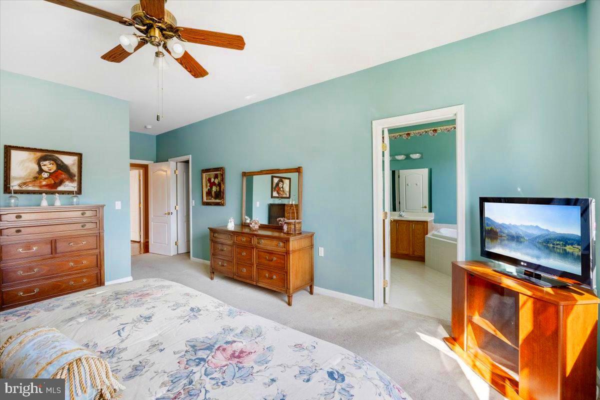 131 Lowell Drive Marlton, NJ 08053 - Photo 35 of 60 a bedroom with furniture and a flat screen tv