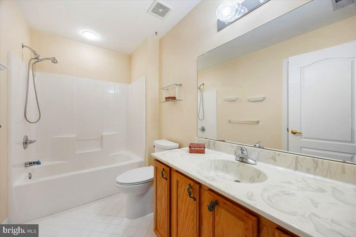 131 Lowell Drive Marlton, NJ 08053 - Photo 39 of 60 a bathroom with a granite countertop sink a toilet and shower