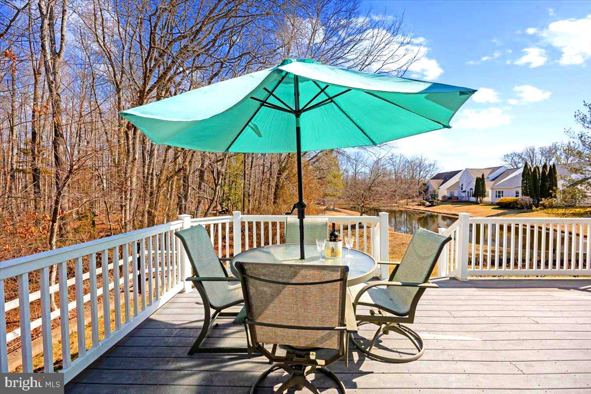 131 Lowell Drive Marlton, NJ 08053 - Photo 4 of 60 a view of a chair and table on the deck