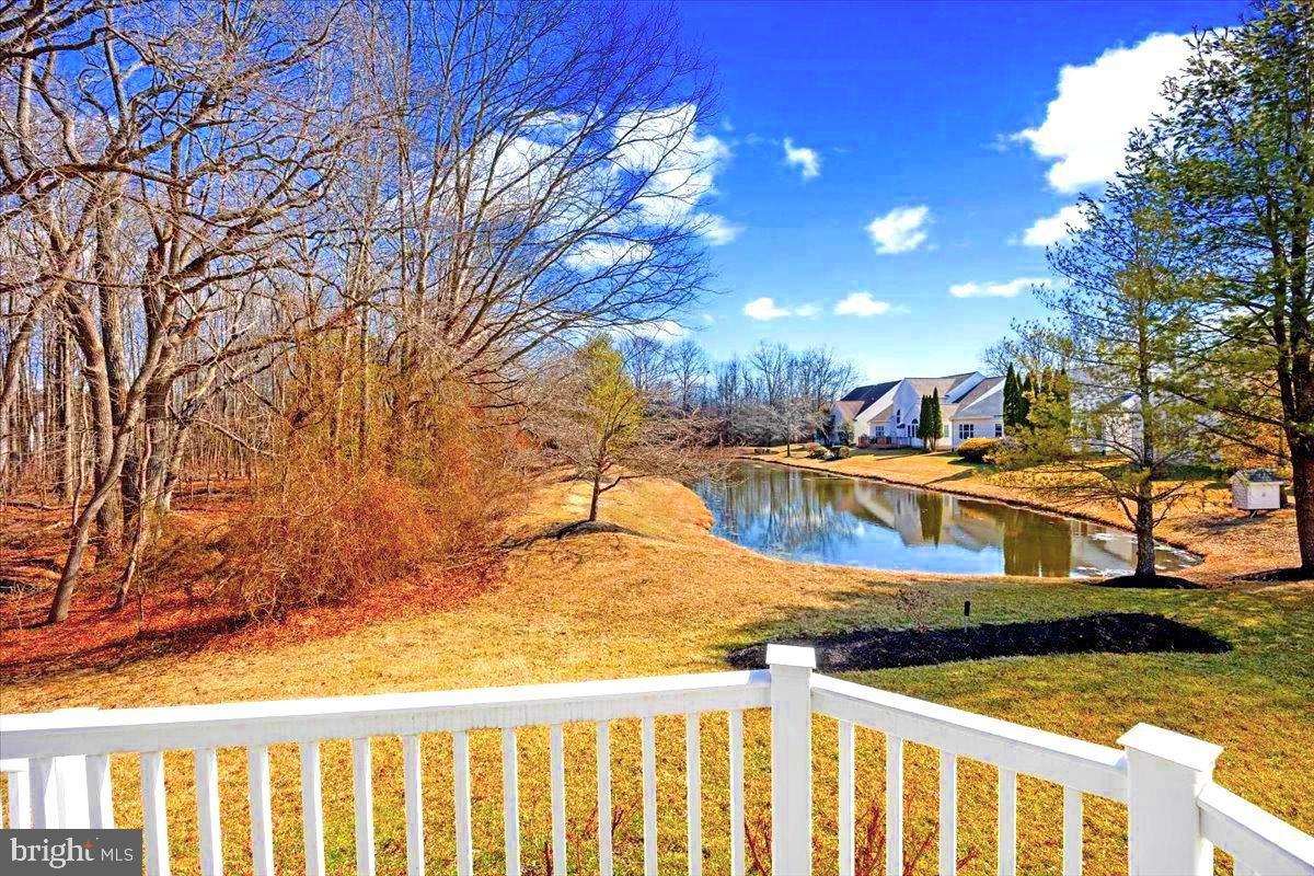 131 Lowell Drive Marlton, NJ 08053 - Photo 5 of 60 a view of a swimming pool with a yard