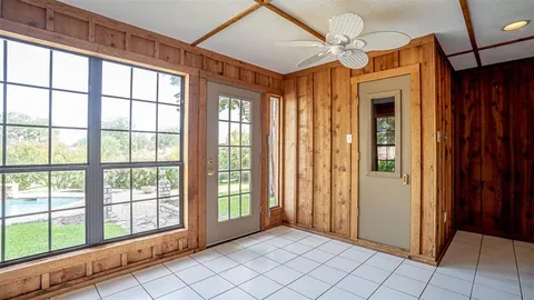 a bedroom with a bed and curtain