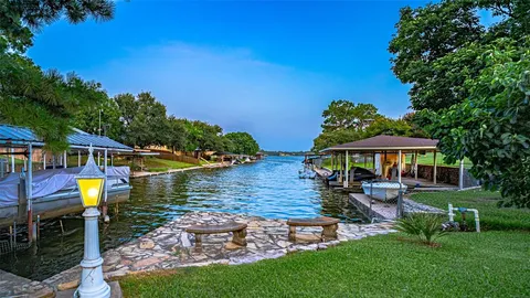 a view of a house with backyard garden and swimming pool