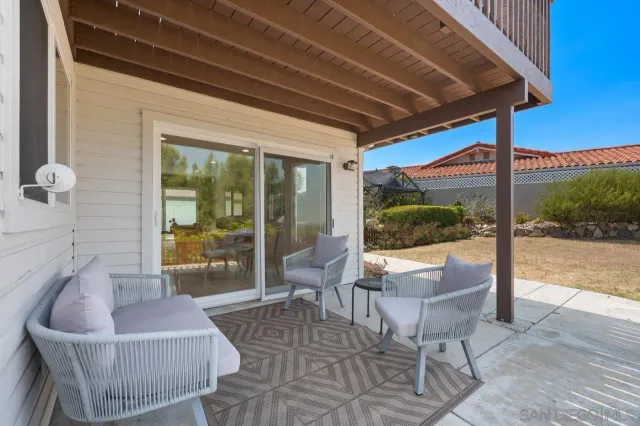a view of staircase with furniture and lots of windows