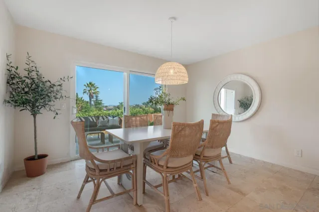 a view of a hallway with wooden floor and entryway